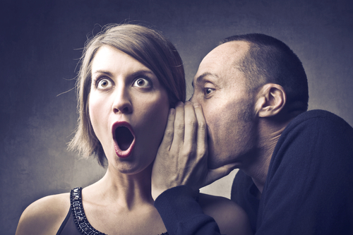 A person whispering a secret
