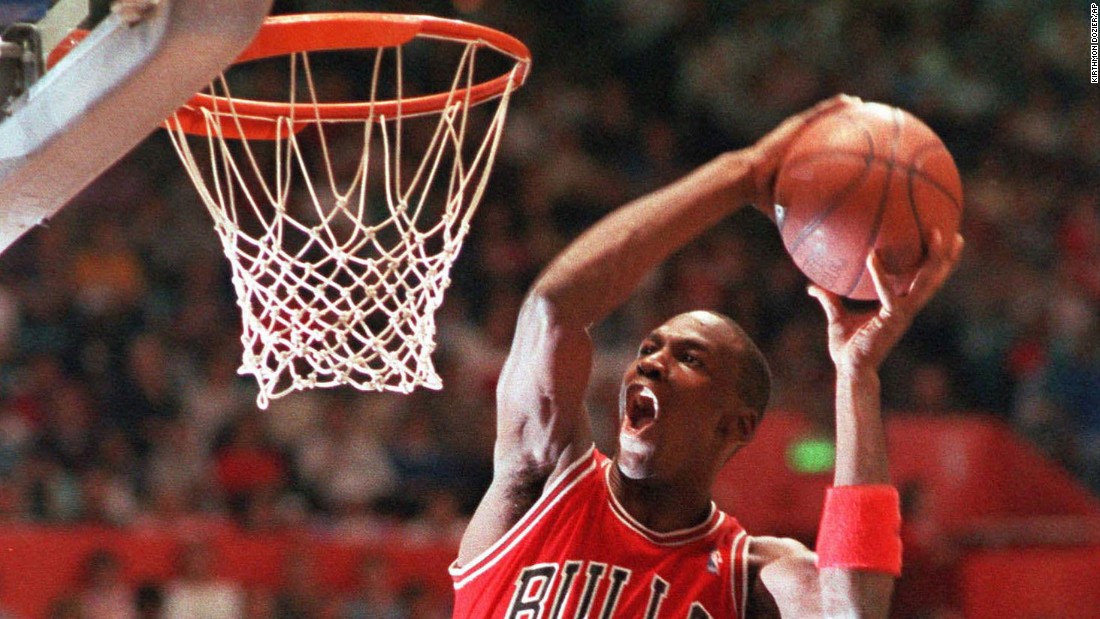 A basketball slam dunk